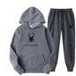 .A casual sports outfit consisting of a long-sleeved hooded t-shirt and elastic-waist pants.